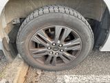 a car that has a flat tire on the side of the road