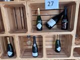 many bottles of wine on display in a wooden crate