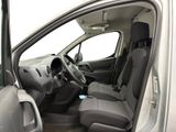 the interior of a car with the door open and the driver ' s seat down