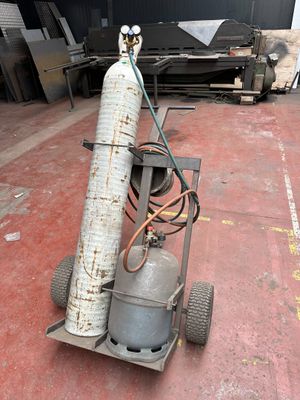 a propanene on a cart in a warehouse