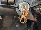 a close up of a car dashboard with a key on it