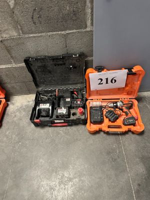 two tools that are sitting on the floor next to each other