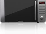 an image of a microwave oven with a digital clock on it