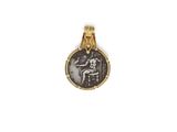 a gold pendant with an image of a man and a woman