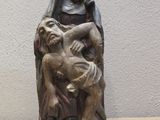 statue of a woman holding a child on her lap