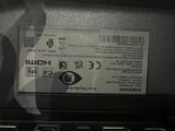 a black and white photo of a laptop with a sticker on it
