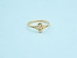 a gold ring with a small diamond on top of it