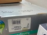 a box that is sitting on the floor next to a cup