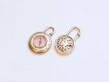 an image of a pair of earrings with a tree on them