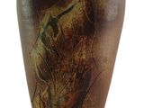 a brown vase with a painting on it on a white background