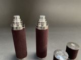 three different types of lighters on a table with one lighter in the foreground