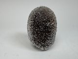 a close up of a black and white object on a white surface