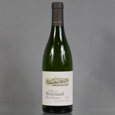 a bottle of wine that is sitting on a table