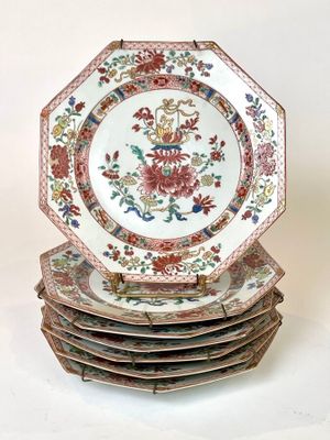 four plates stacked on top of each other on a table