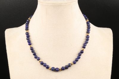 a close up of a necklace on a mannequin mannequin