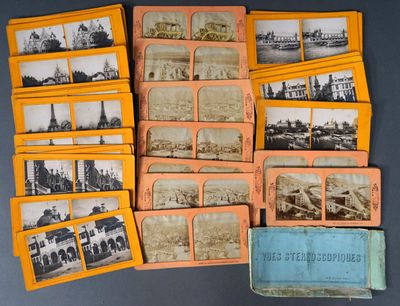 a lot of old photographs on the table together