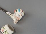 a pipe and a pipe holder on a table