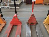 several pallets are lined up in a warehouse with pallets in the background