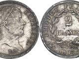 a silver coin with a portrait of a man on it