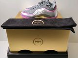 the nike air max 97 is on top of a box
