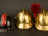 three helmets sitting next to each other on a table