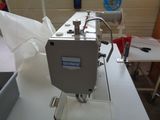 a sewing machine sitting on a table in a room