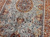 an image of a large oriental rug on a wooden floor