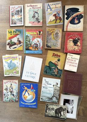 many children ' s books laid out on the floor