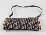 a close up of a purse with a strap on a white surface