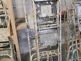 a lot of chairs and ladders that are in a room