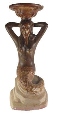 a statue of a mermaid holding a bowl on her head