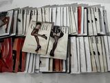 a lot of cd ' s that are stacked on top of each other