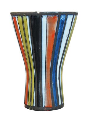 a multicolored vase sitting on a white surface