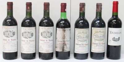several bottles of wine are lined up in a row