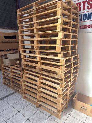 pallets stacked on top of each other in front of a store