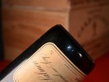 a bottle of wine that is sitting on a table