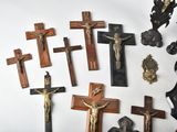 a lot of crosses that are on the wall