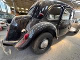 a black car that is parked in a garage