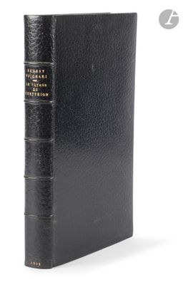 a black book with a gold binding and a black cover