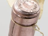 a bottle of wine with a cork stopper on it