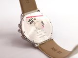 a close up of a wrist watch on a white surface