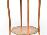 a round wooden table with a marble top on a white background