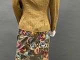 a mannequin dress and jacket with floral print on the skirt