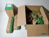 a box full of boxes of green items on a table