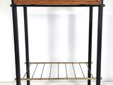 a small wooden table with a metal shelf underneath it