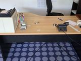 a desk with a computer and a printer on it