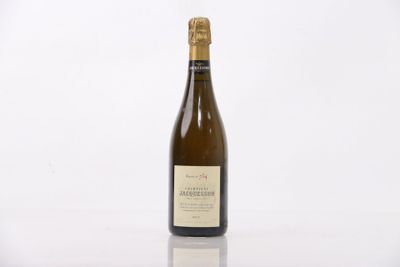 the bottle of wine is sitting on the table with a white background