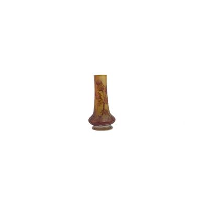 a small vase that is sitting on a white surface