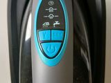 a close up of a black and blue device on a counter
