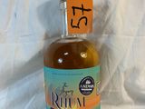 a bottle of rum sitting on a table with a price tag on it